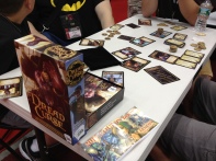 In the exhibit hall two of us sat down to try out Dread Curse. This was a neat role selection pirate game that can play up to 8 players.